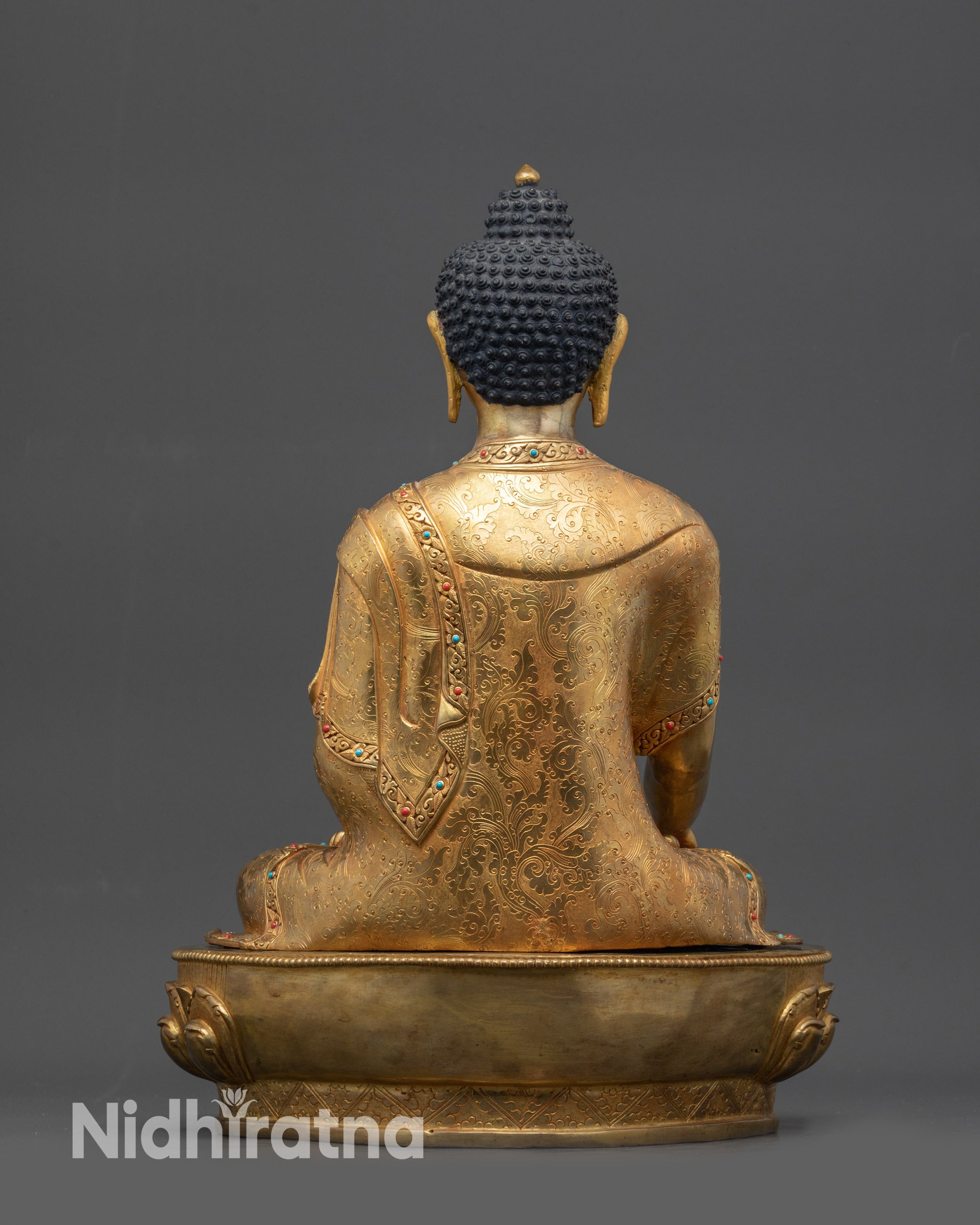 Back view Shakyamuni Buddha statue carved robe patterns copper alloy base