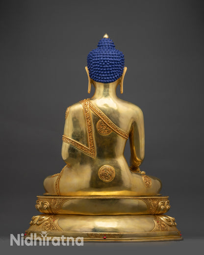 Back view Shakyamuni Buddha statue displaying sculpted robes and meditation base