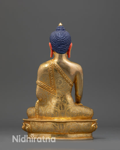 Back view Shakyamuni Buddha statue highlighting carved robe details and gold fire-gilded finish