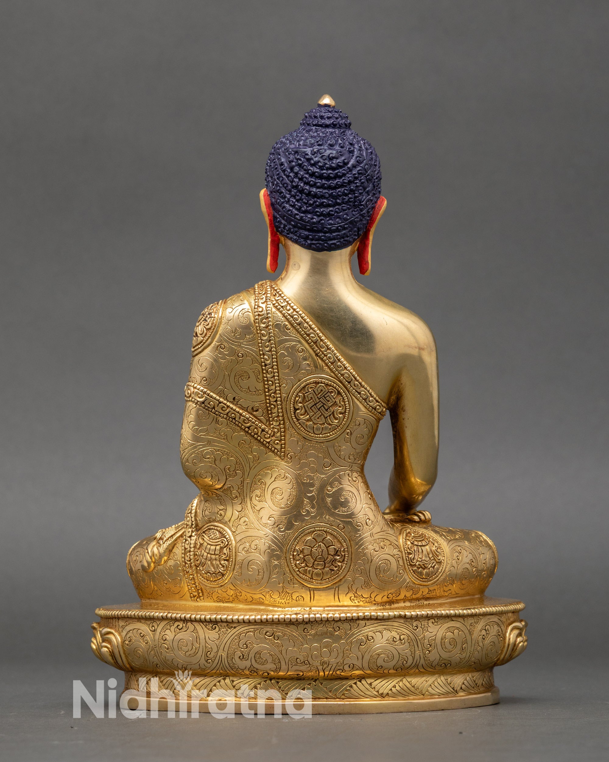 Back view Shakyamuni Buddha statue intricate Tibetan symbols lotus pedestal craftsmanship