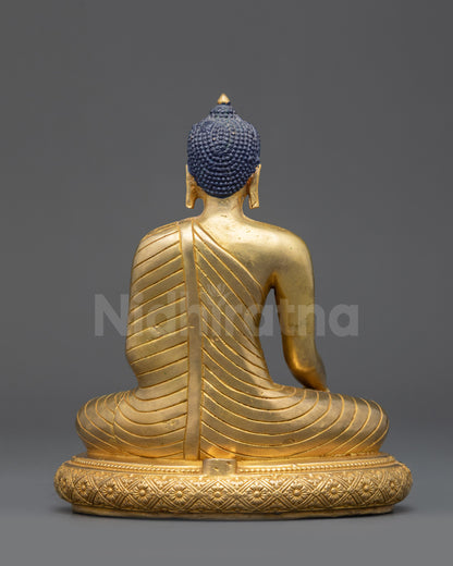 Back view Shakyamuni Buddha statue monk robe detailing traditional Tibetan artwork