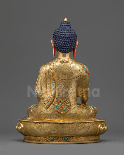 Back view Shakyamuni Buddha statue showing robe folds and hollow chamber for mantra