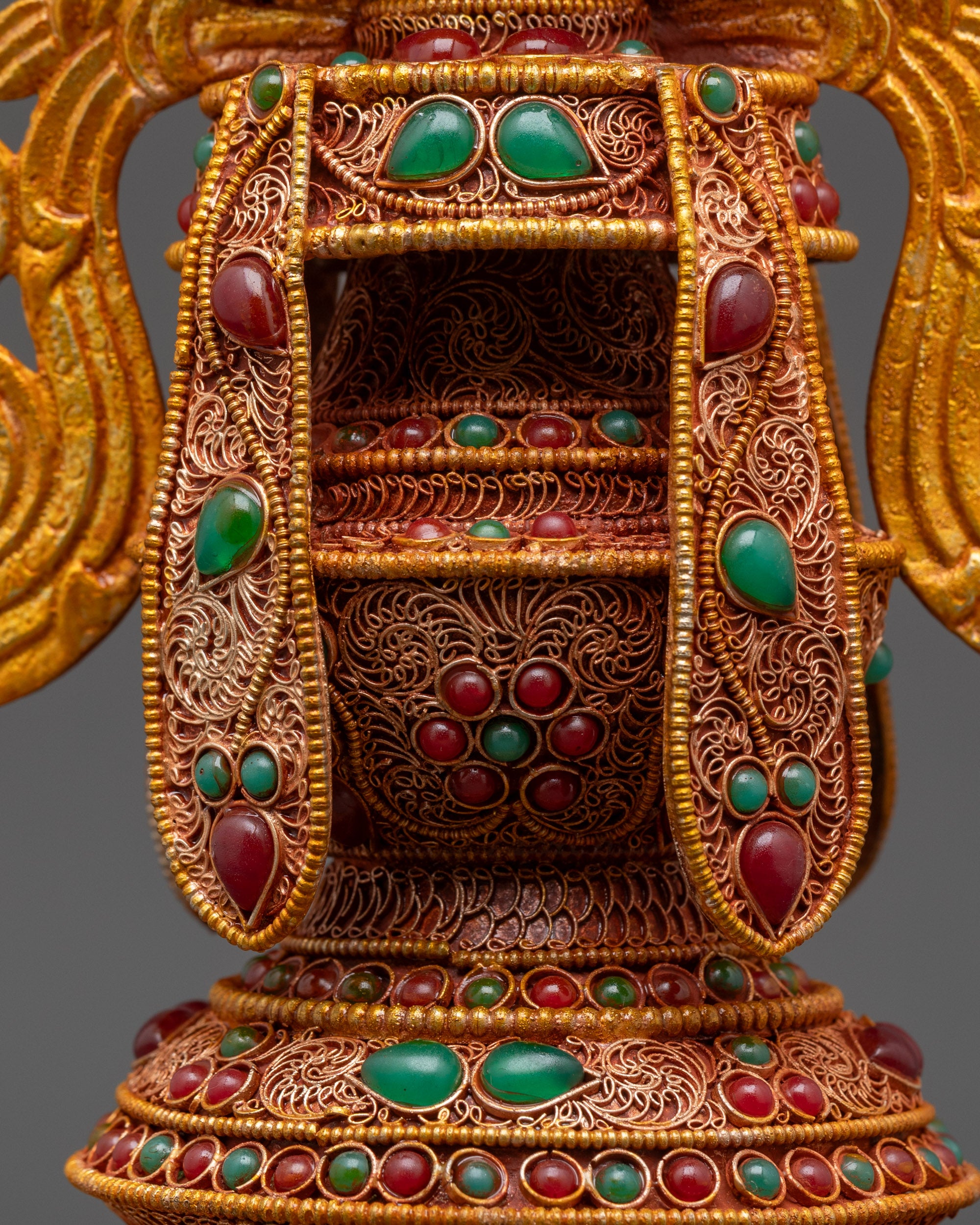 Back view Tibetan Ashtamangala displaying detailed gold-plated knot work and stone patterns
