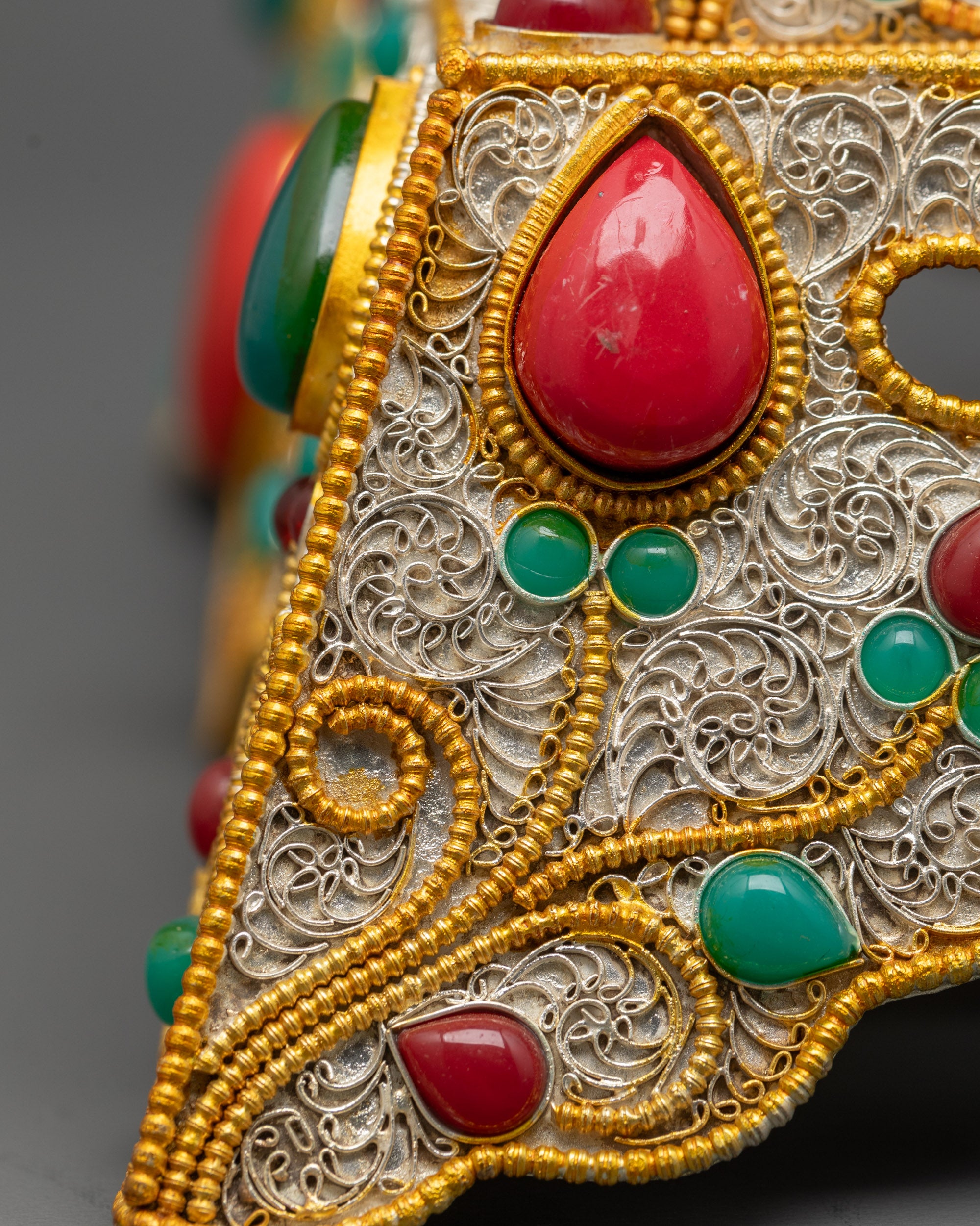Back view Tibetan Mandala displaying detailed craftsmanship and ornate silver-gold filigree design