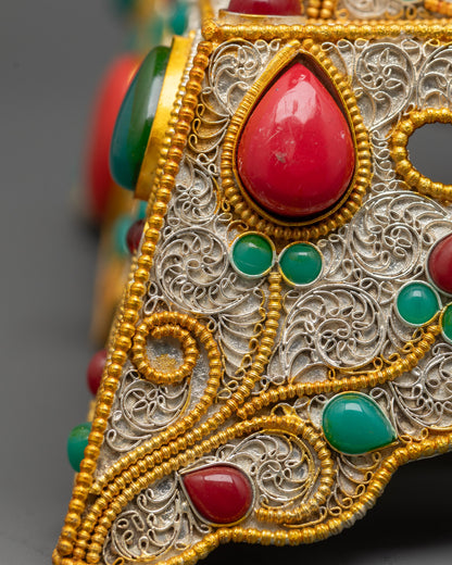 Back view Tibetan Mandala displaying detailed craftsmanship and ornate silver-gold filigree design