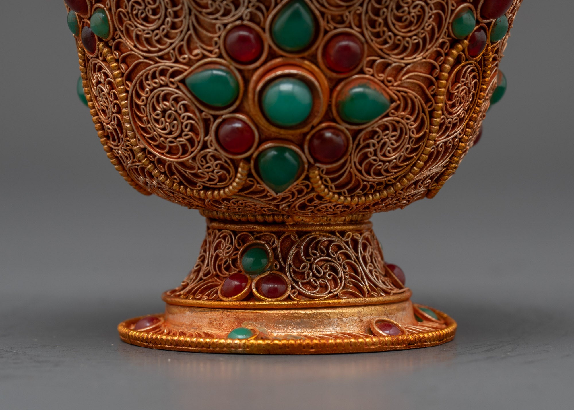 Back view Tibetan water offering bowl showing detailed artisan craftsmanship