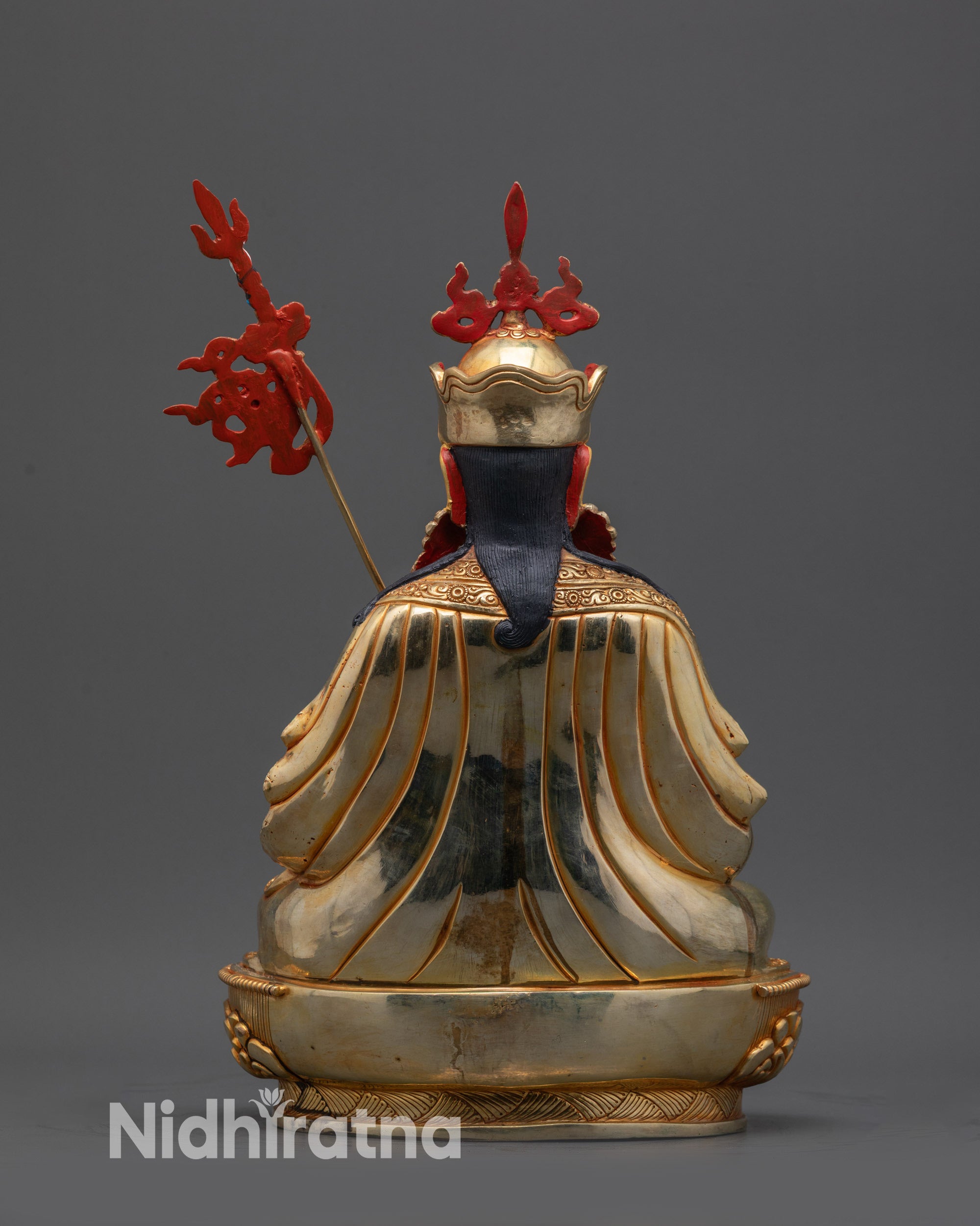 Back view Tsokye Dorje robe details and lotus seat with engraved patterns and textures