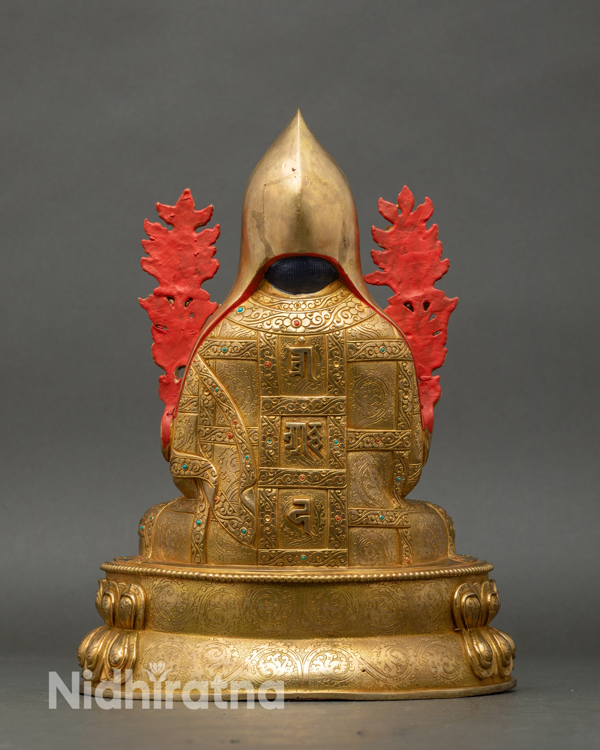 Back view Tsongkhapa statue showing sacred mantras engraved on the back