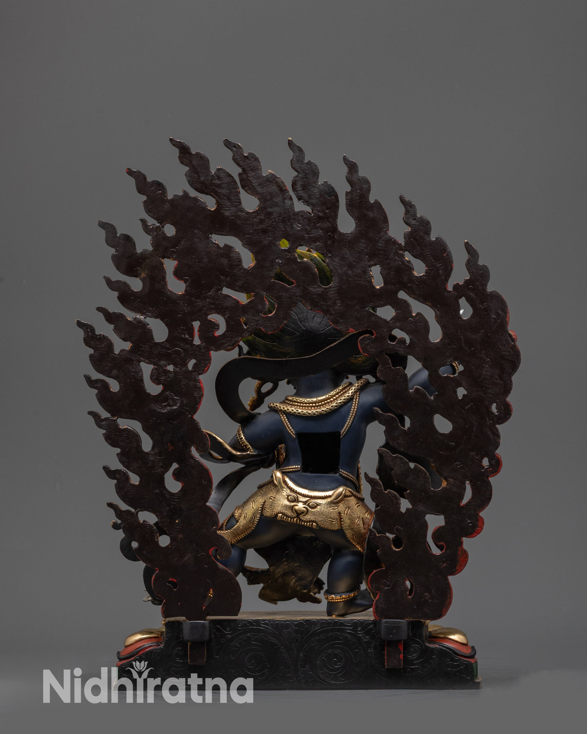 Back view Vajrapani Buddhist statue highlighting lotus seat and robe details