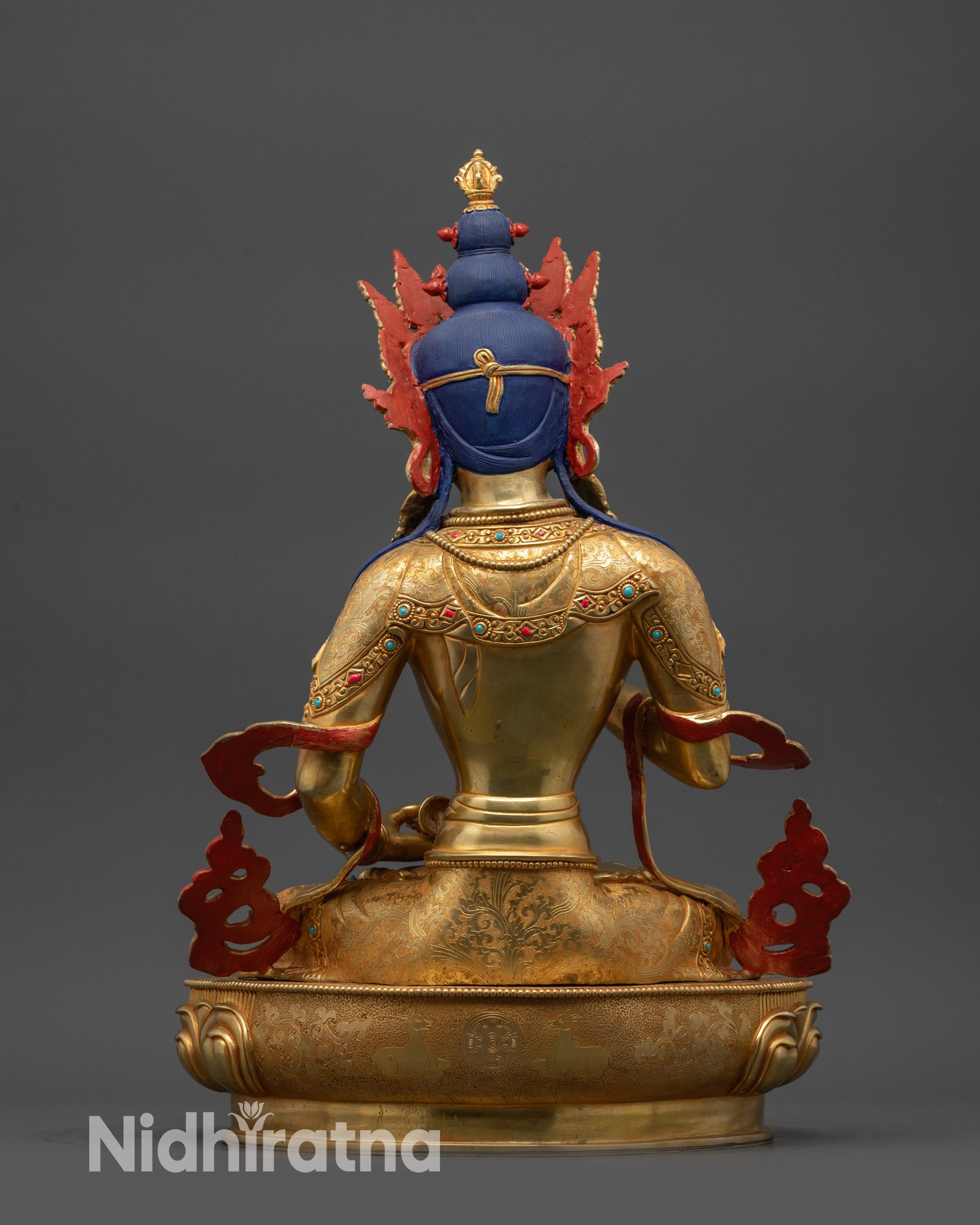Back view Vajrasattva statue showing dual deer and Dharma Wheel carved on the lotus seat