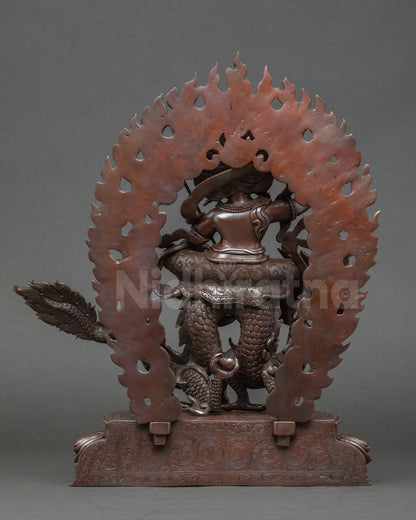 Back view White Dzambhala Buddha statue, luminous halo highlighting enlightened presence
