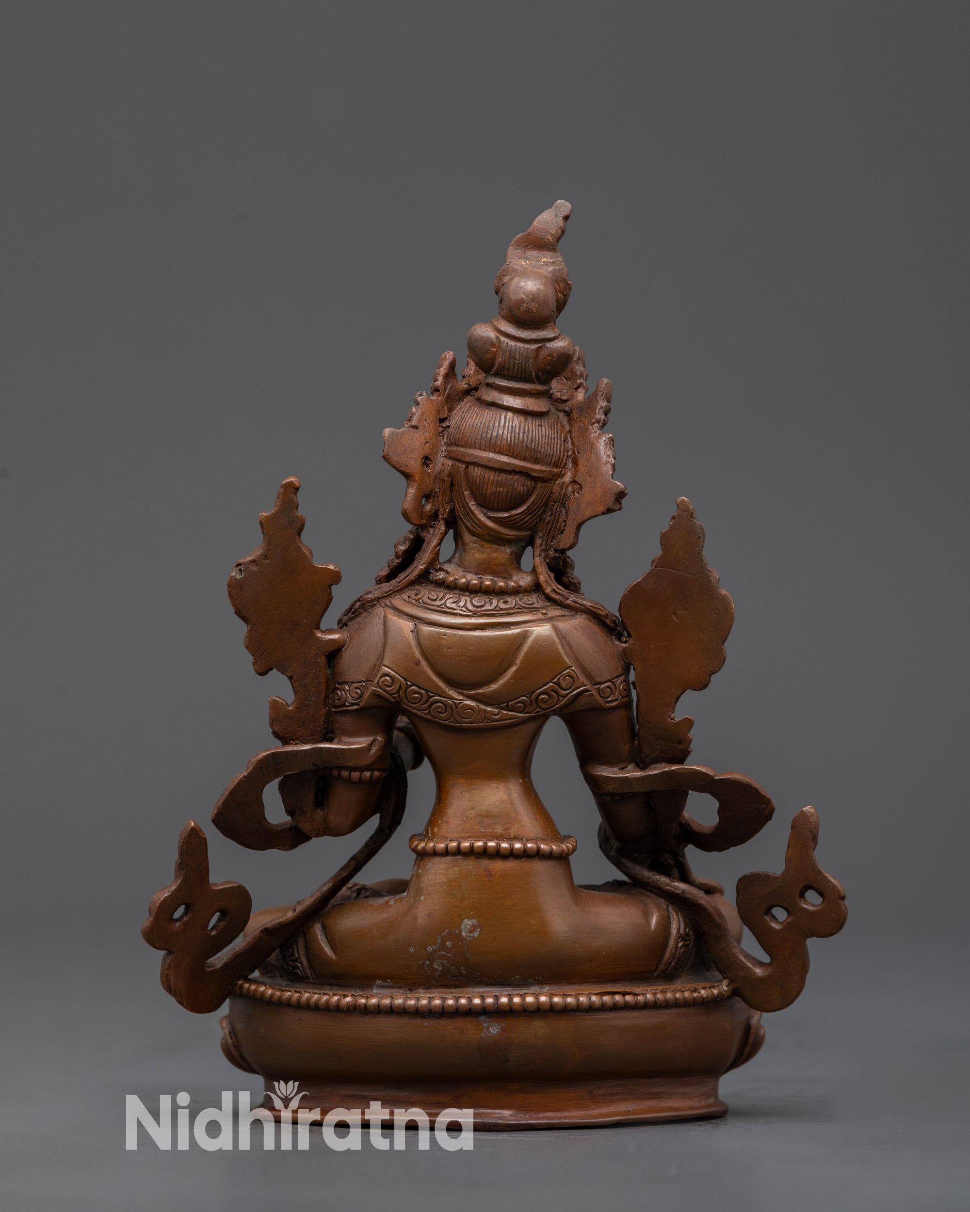 Back view White Tara Statue showing detailed patterns on robe and lotus seat