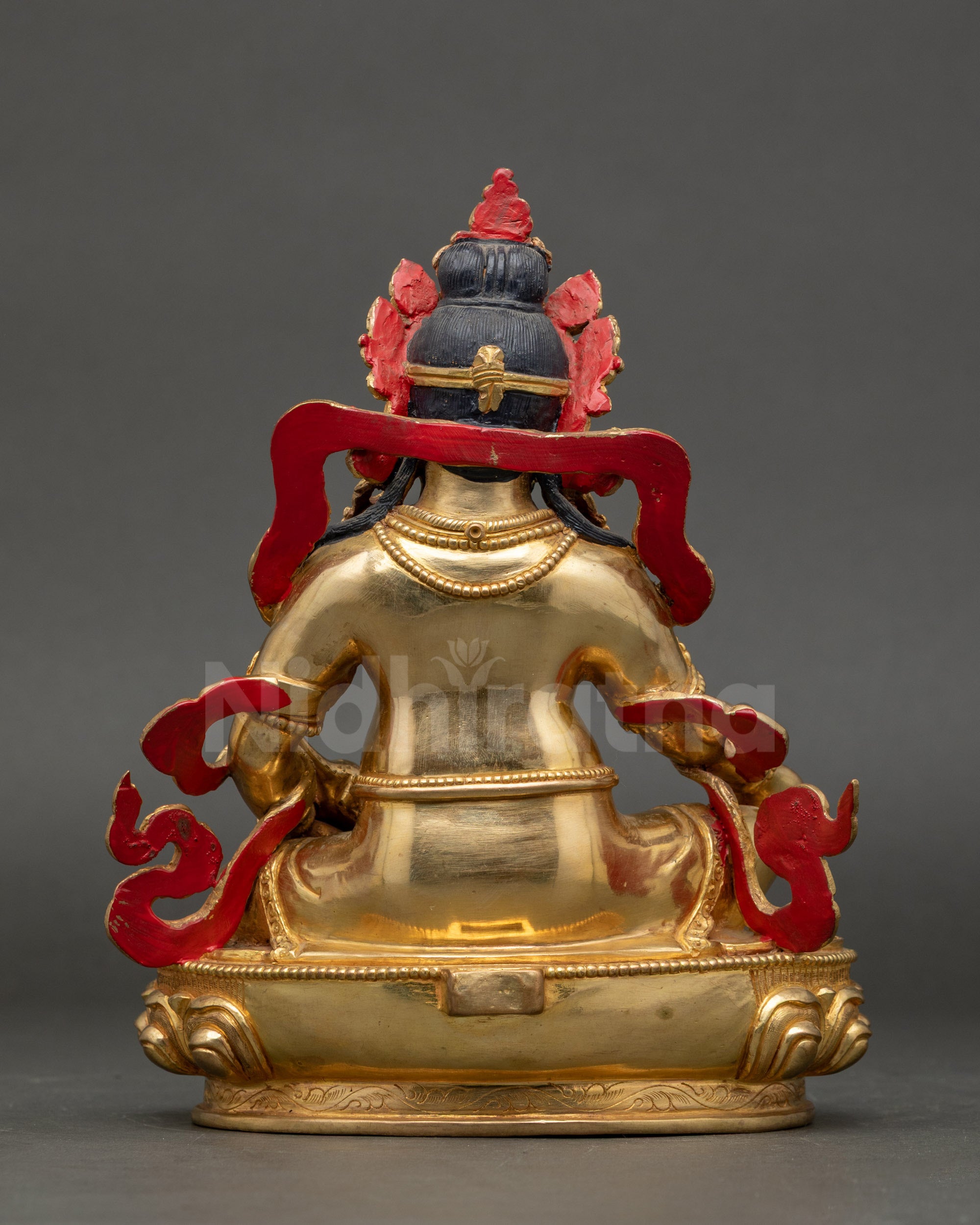 Back view Yellow Dzambhala Buddhist sculpture on lotus throne, Vajrayana altar décor