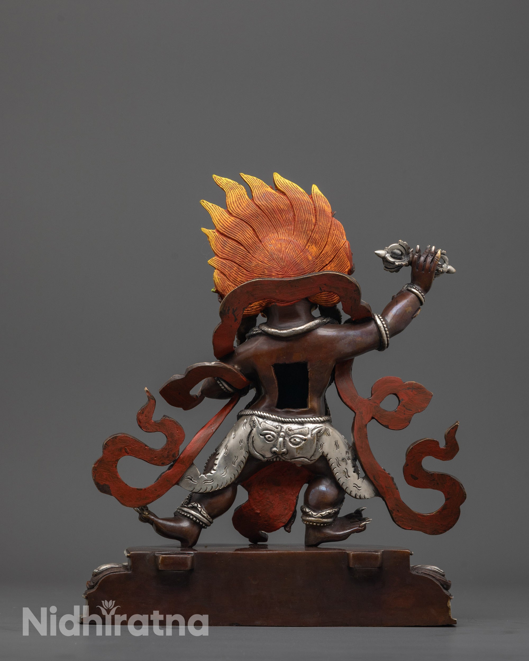 Back view featuring tiger on garments throne and silver plating on oxidized statue
