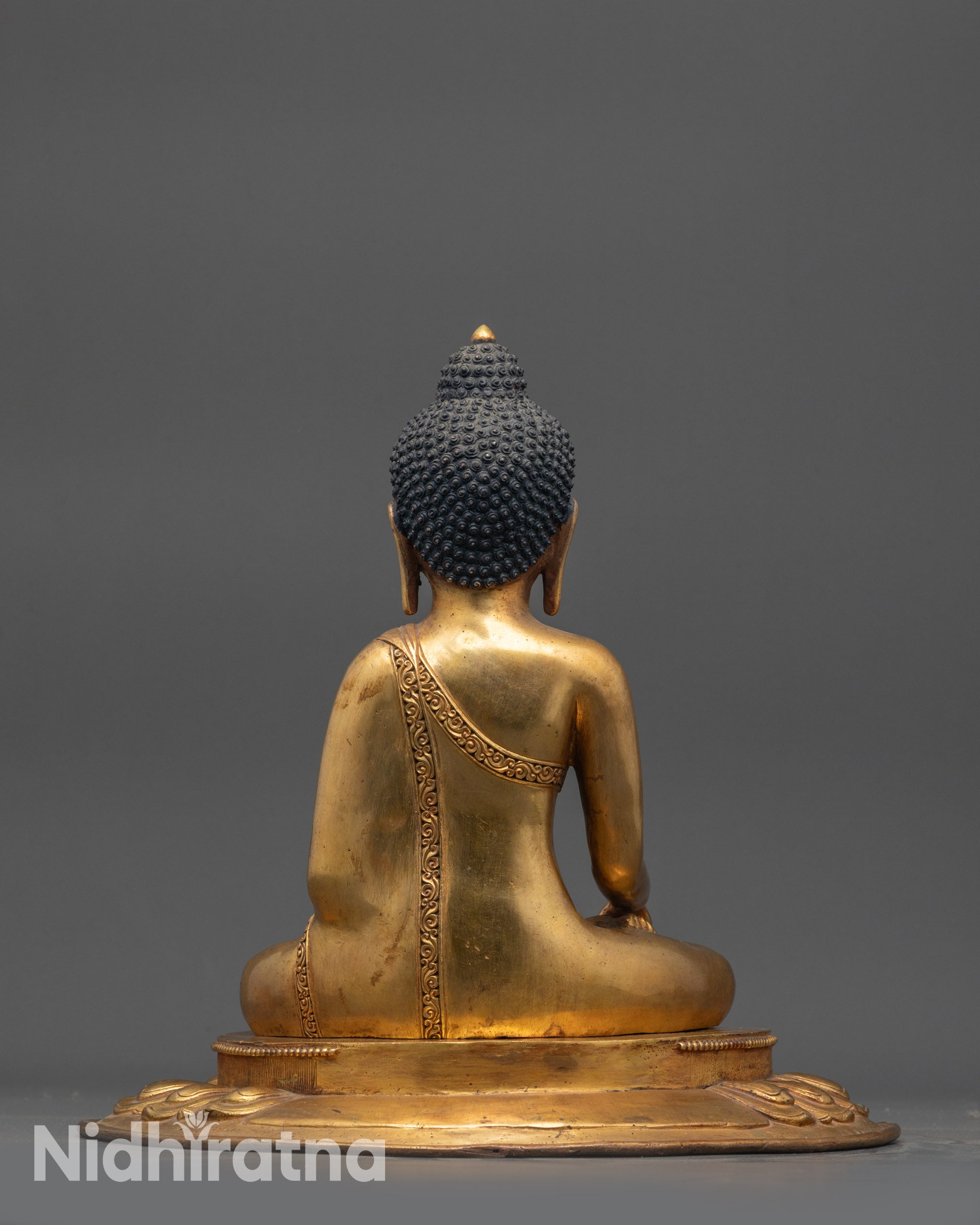 Back view of 1990s Shakyamuni Buddha highlighting carved monk’s robe and antique design