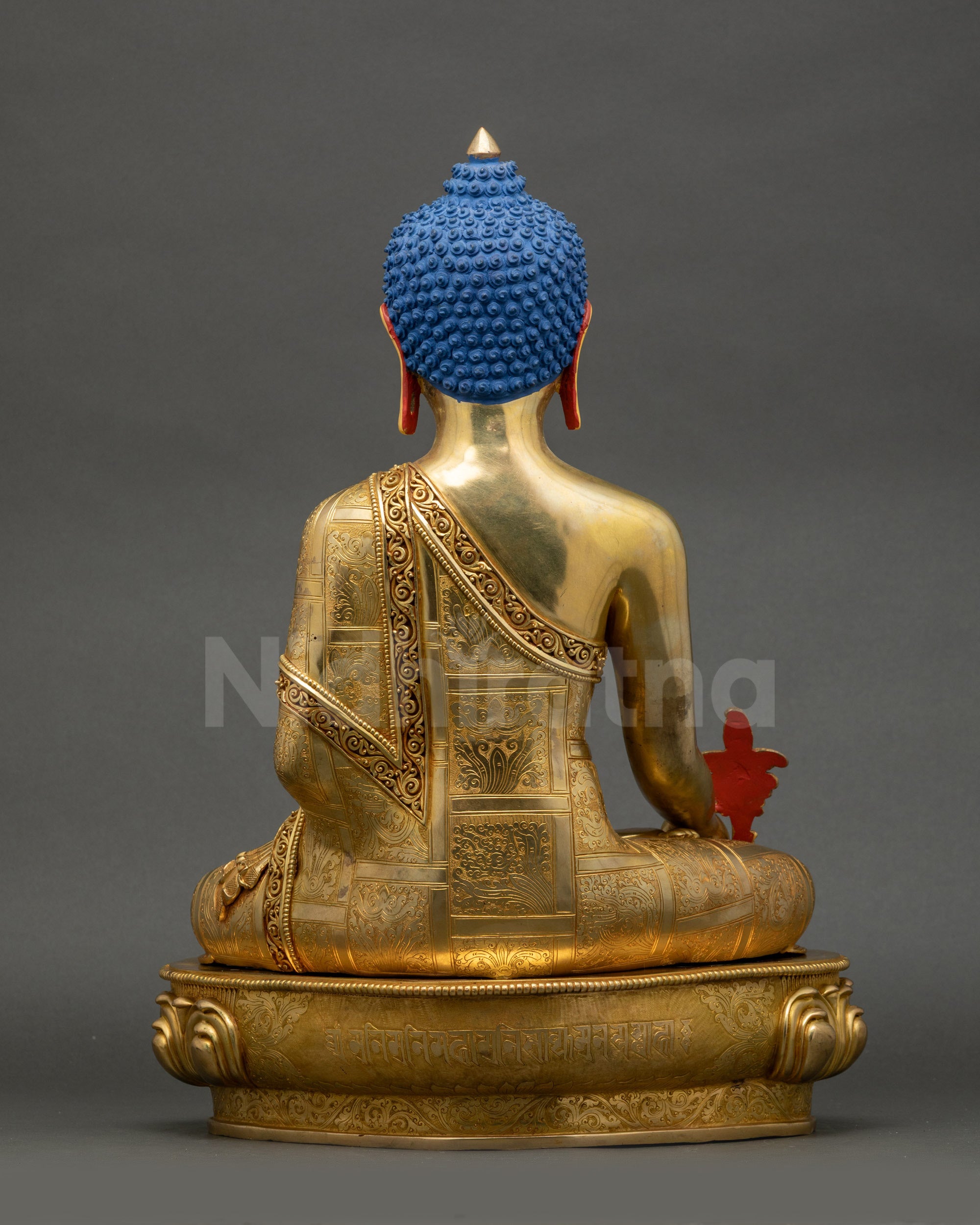 Back view of 24K gold Medicine Buddha statue showing detailed lotus seat and robes