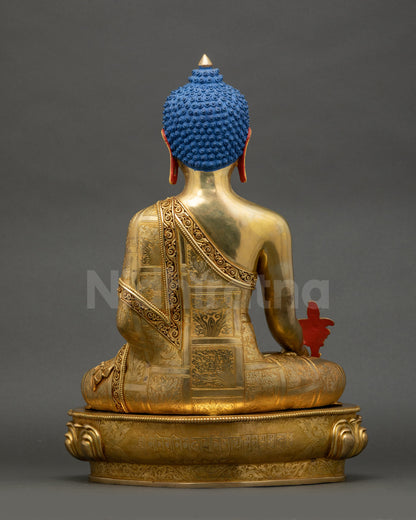 Back view of 24K gold Medicine Buddha statue showing detailed lotus seat and robes