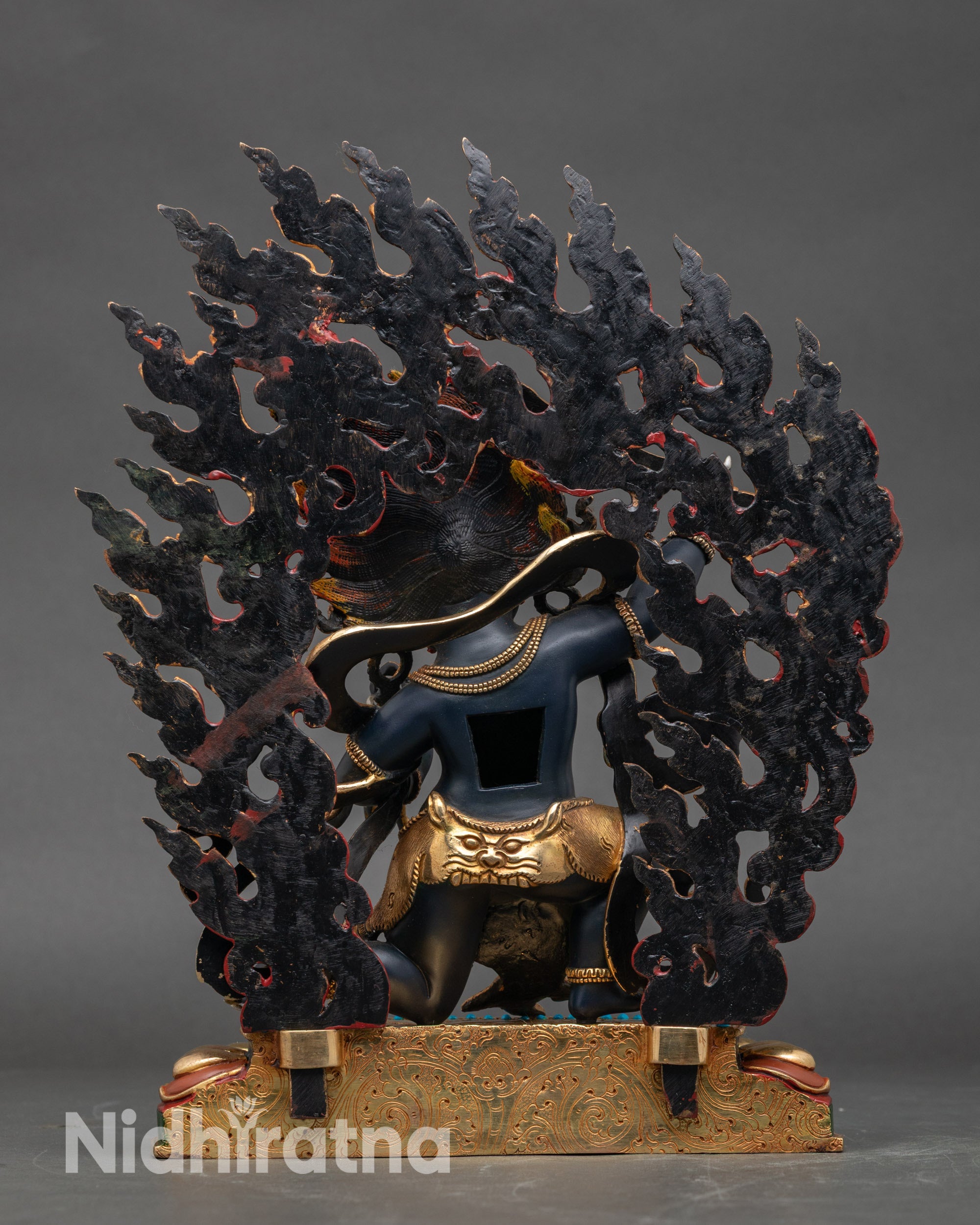 Back view of Achala Statue showing detailed lotus seat, serpent, and sacred adornments