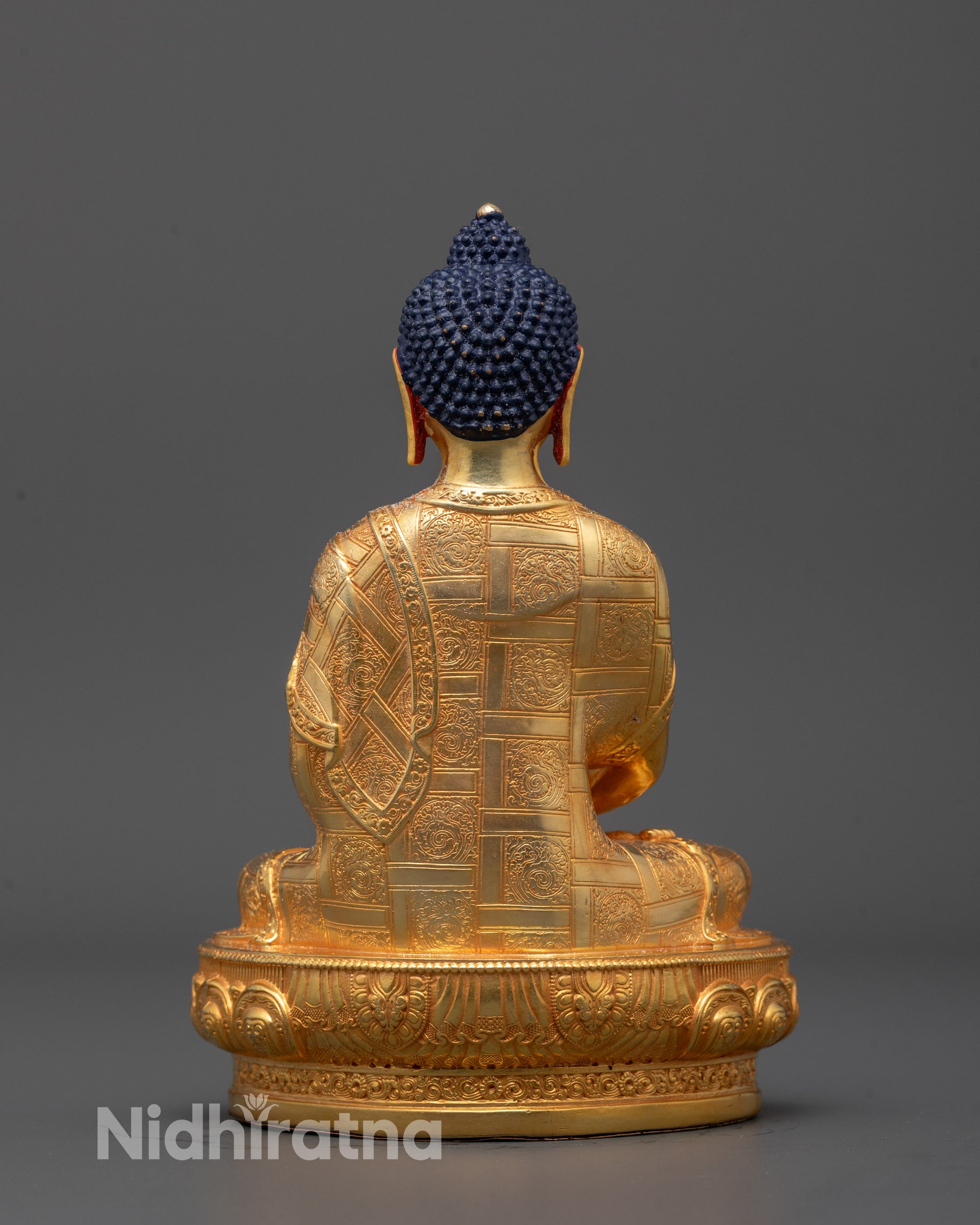 Back view of Amitabha Buddha Statue revealing smooth gold-polished copper surface