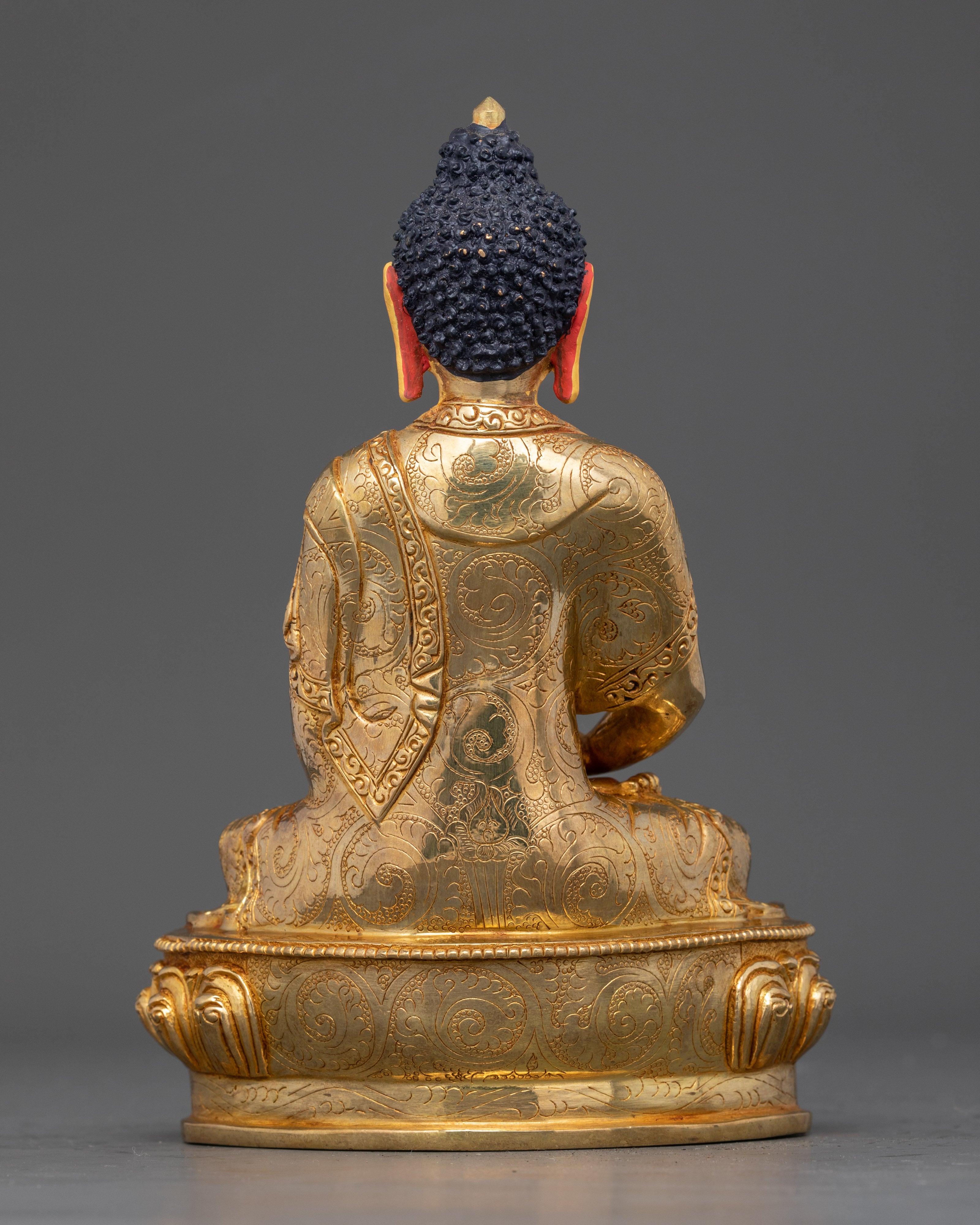 Back view of Amitabha Buddha figurine showing intricate lotus throne and gold details