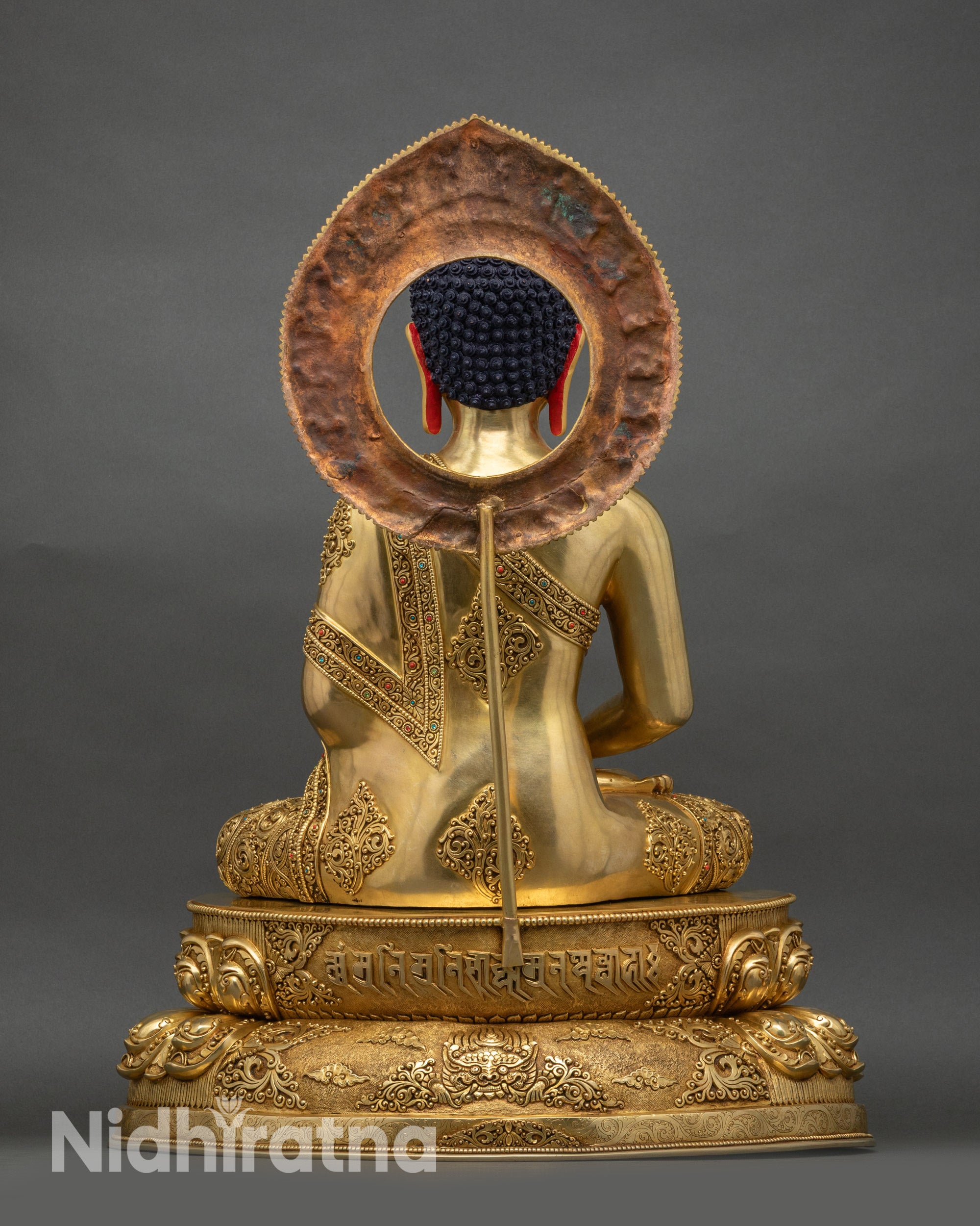 Back view of Amitabha Buddha statue showing halo design and craftsmanship