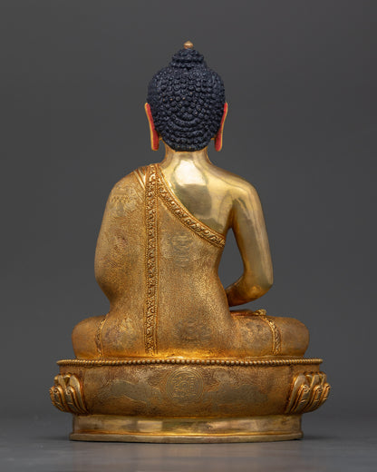 Back view of Amitabha Buddha statue showing intricate fire-gilded details, meditation altar