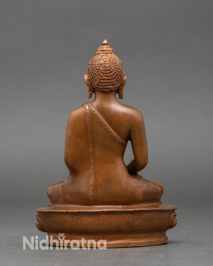 Back view of Amitabha Buddha statue with lotus throne and intricate oxidized finish
