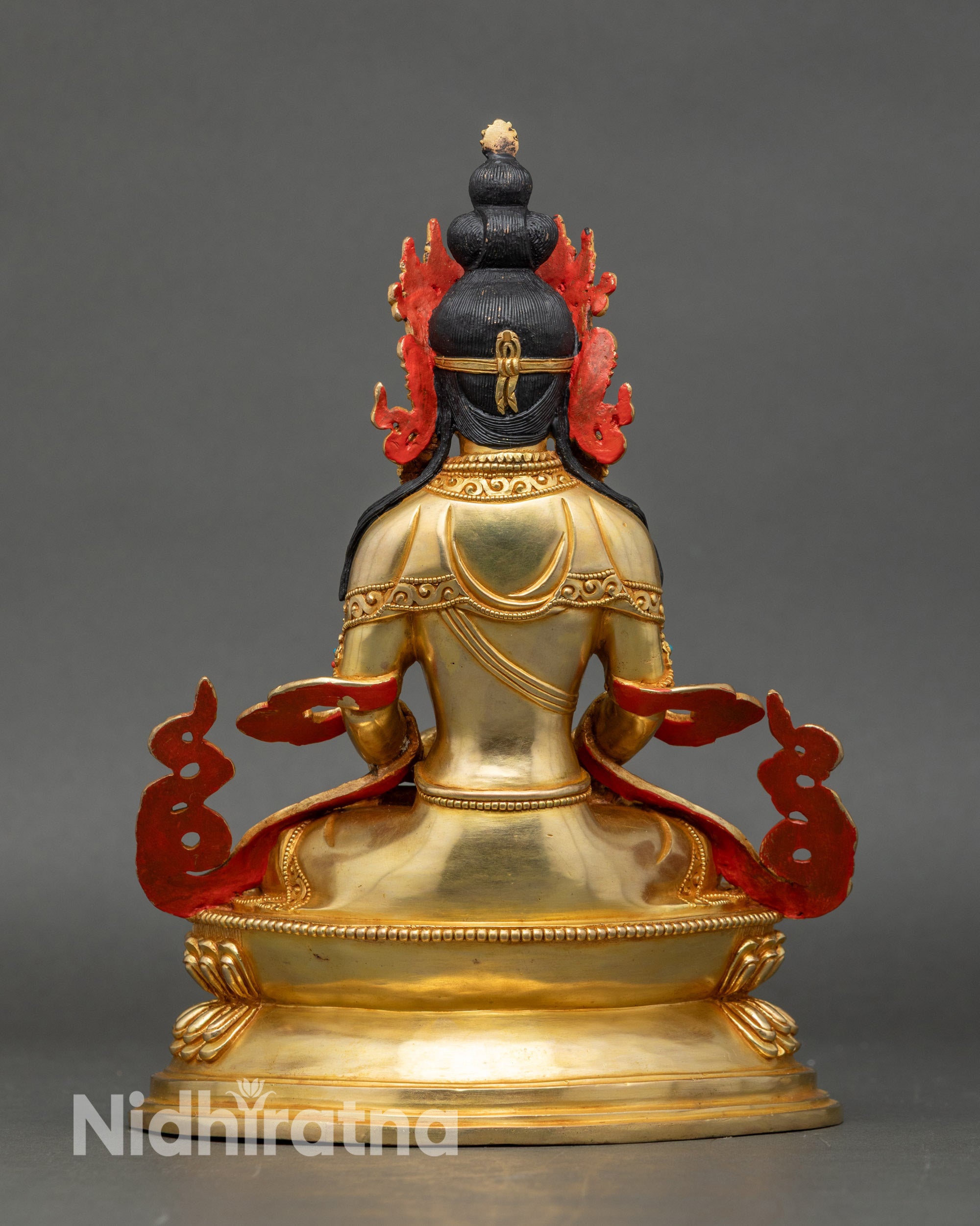 Back view of Amitayus Buddha statue showing detailed lotus pedestal and Himalayan art
