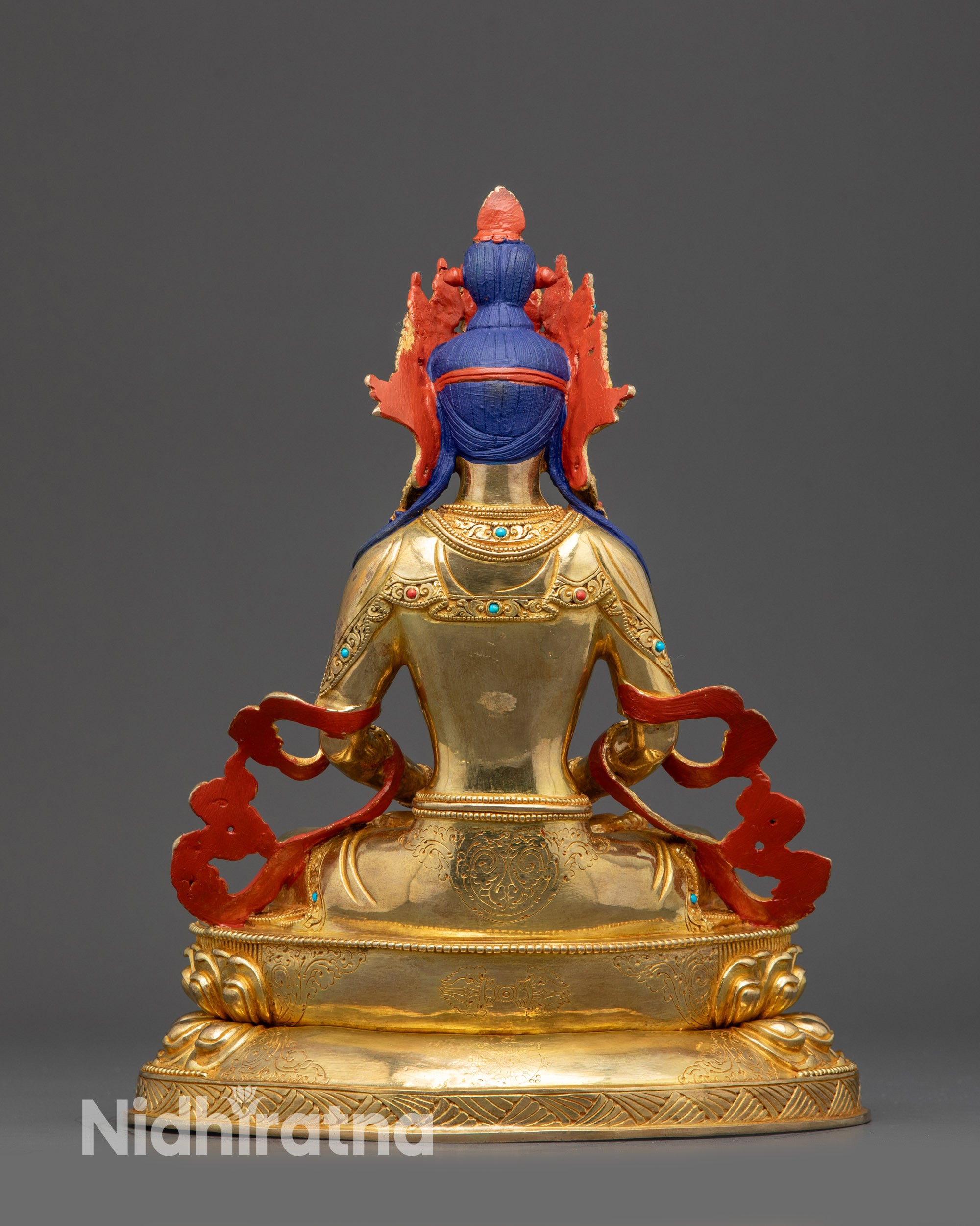 Back view of Amitayus Buddha with carved halo and ornate patterns on copper alloy