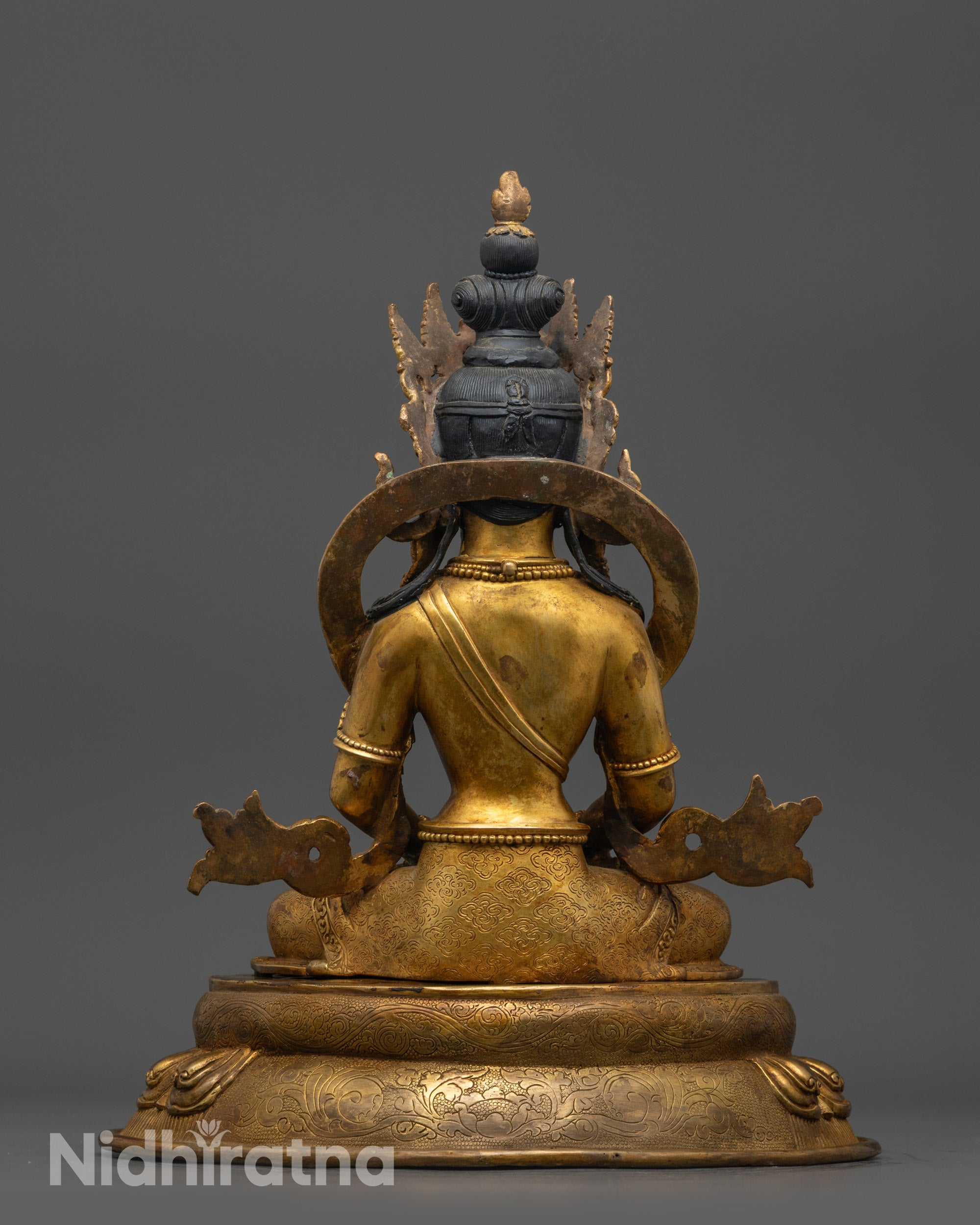 Back view of Amitayus Statue highlighting detailed patterns and gold fire-gilded craftsmanship