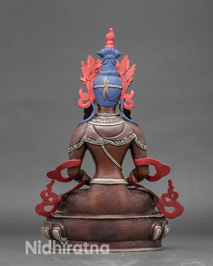 Back view of Amitayus silver-plated statue, showcasing detailed Newari lost-wax artistry and Tibetan Buddhist symbolism