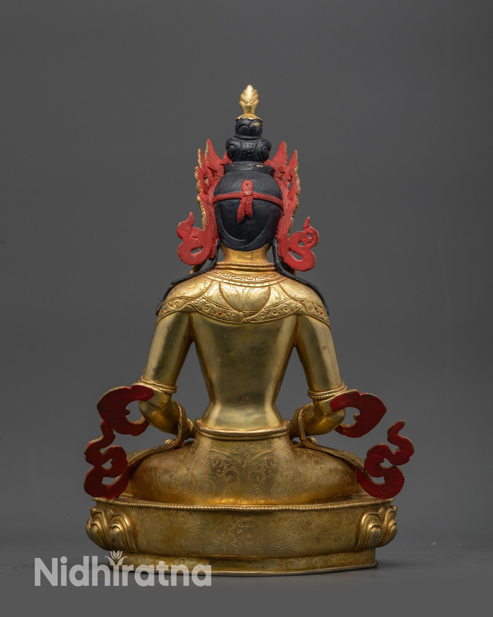 Back view of Amitayus statue highlighting double-layered lotus seat and gold finish