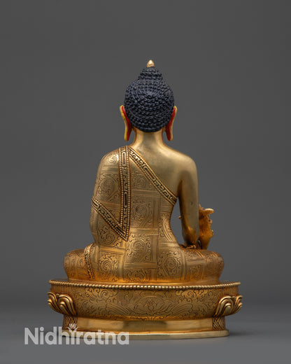 Back view of Bhaisajyaguru statue showing carved robe, floral motifs, and craftsmanship