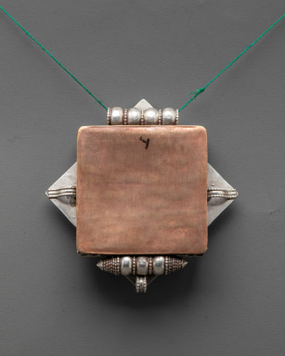Back view of Bishwo Vajra Locket displaying expert artisan carving and traditional Tibetan design
