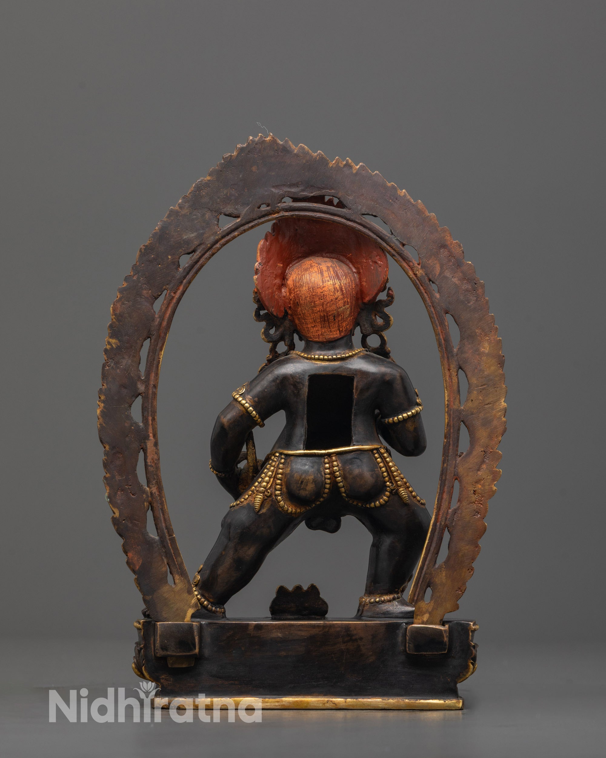 Back view of Black Dzambhala Tibetan wealth deity statue with fierce expression