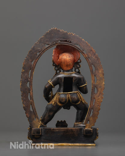 Back view of Black Dzambhala Tibetan wealth deity statue with fierce expression