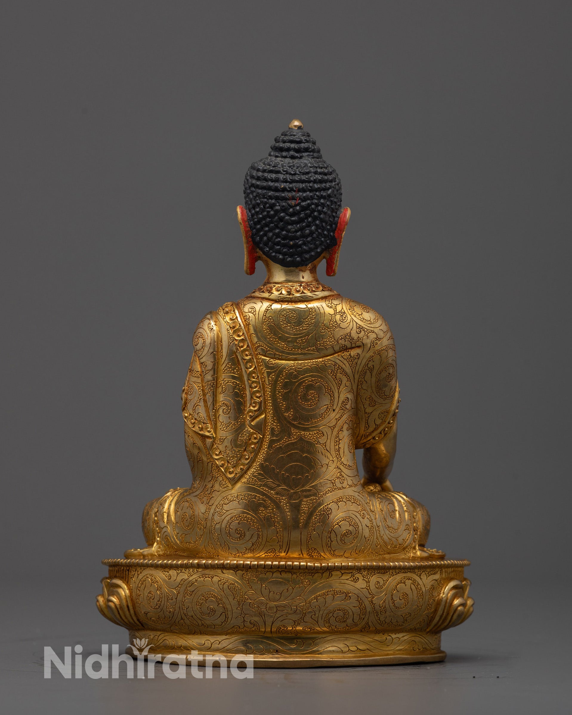 Back view of Buddha Shakyamuni Statue displaying finely carved robe details
