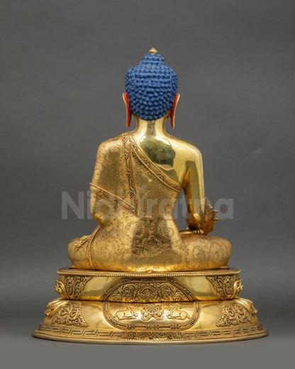 Back view of Buddha statue featuring Wisdom Wheel and pair of Deer on pedestal