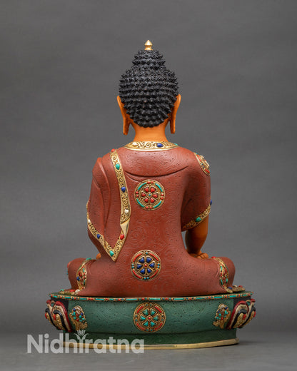 Back view of Buddha statue showing detailed robe folds and ornate lotus pedestal