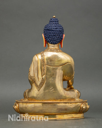 Back view of Buddha statue with detailed carving and lotus pedestal design