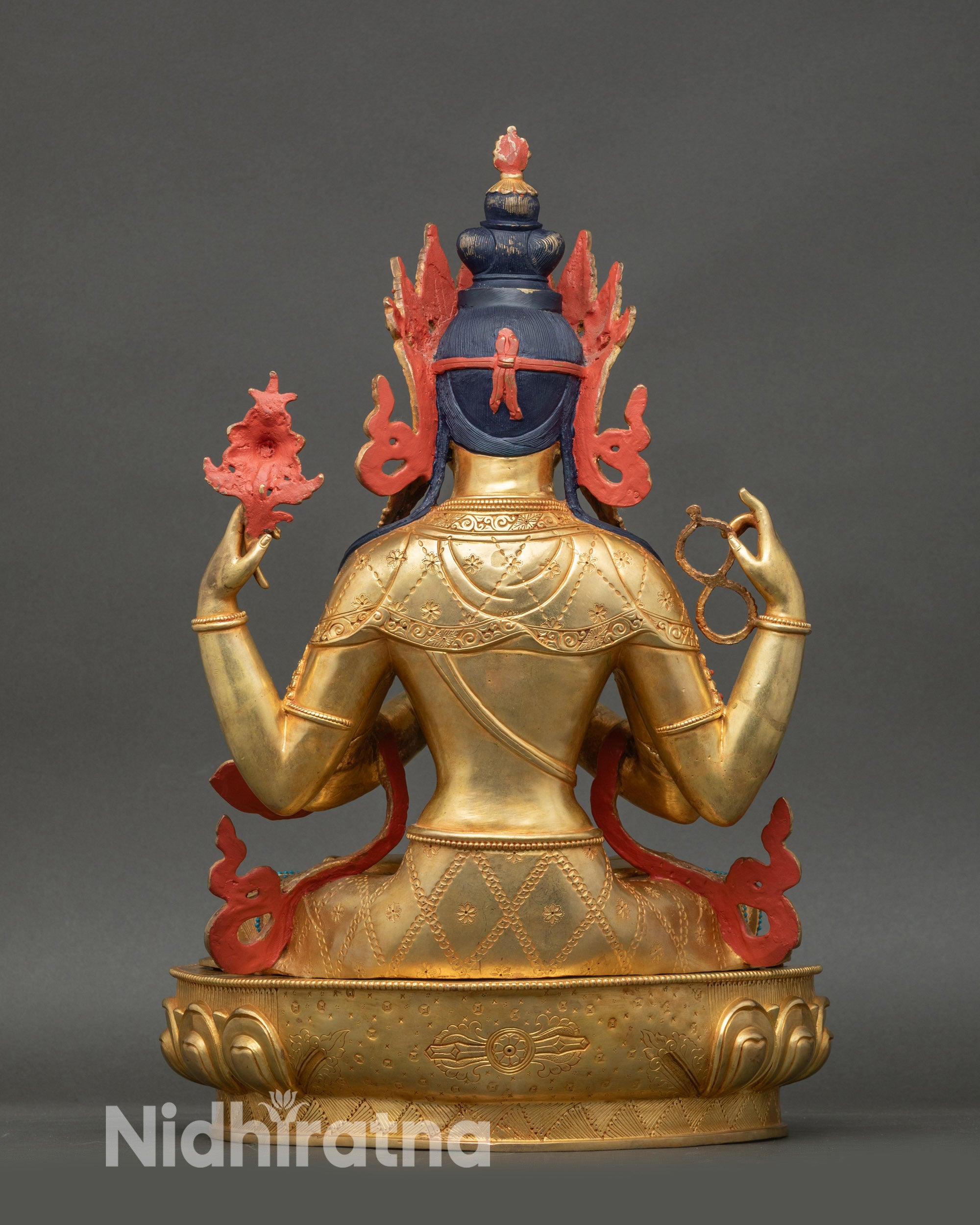Back view of Chenrezig Bodhisattva statue showing lotus seat and gilded detailing