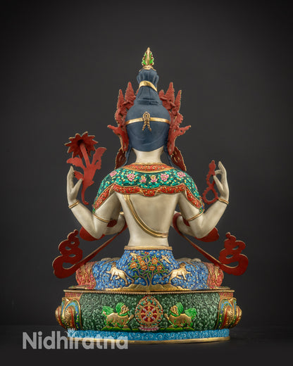 Back view of Chenrezig Statue showing carved dharma wheel, lions, and gold-accented details