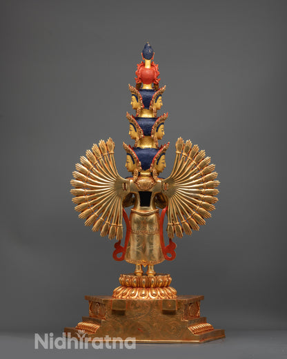 Back view of Chenrezig statue highlighting carved arms, eleven faces, and gold fire-gilded body