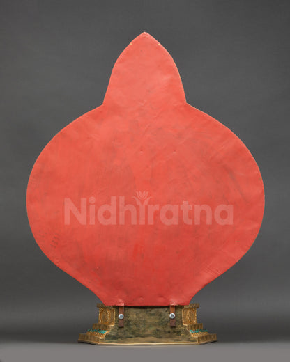Back view of Chenrezig statue highlighting detailed halo motifs and finely carved patterns