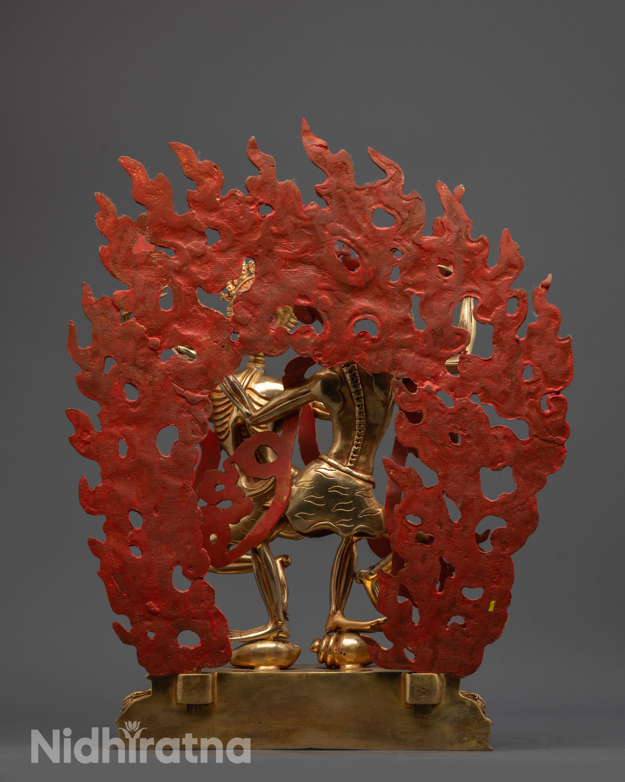 Back view of Chitipati Statue highlighting skull crowns and dynamic dancing pose