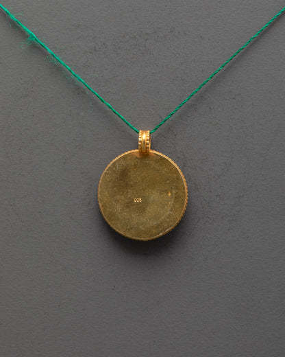Back view of Dharma Wheel Locket showing smooth copper finish and artisan craftsmanship