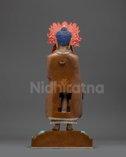 Back view of Dipankara Buddha statue showing intricate robe details and lotus seat