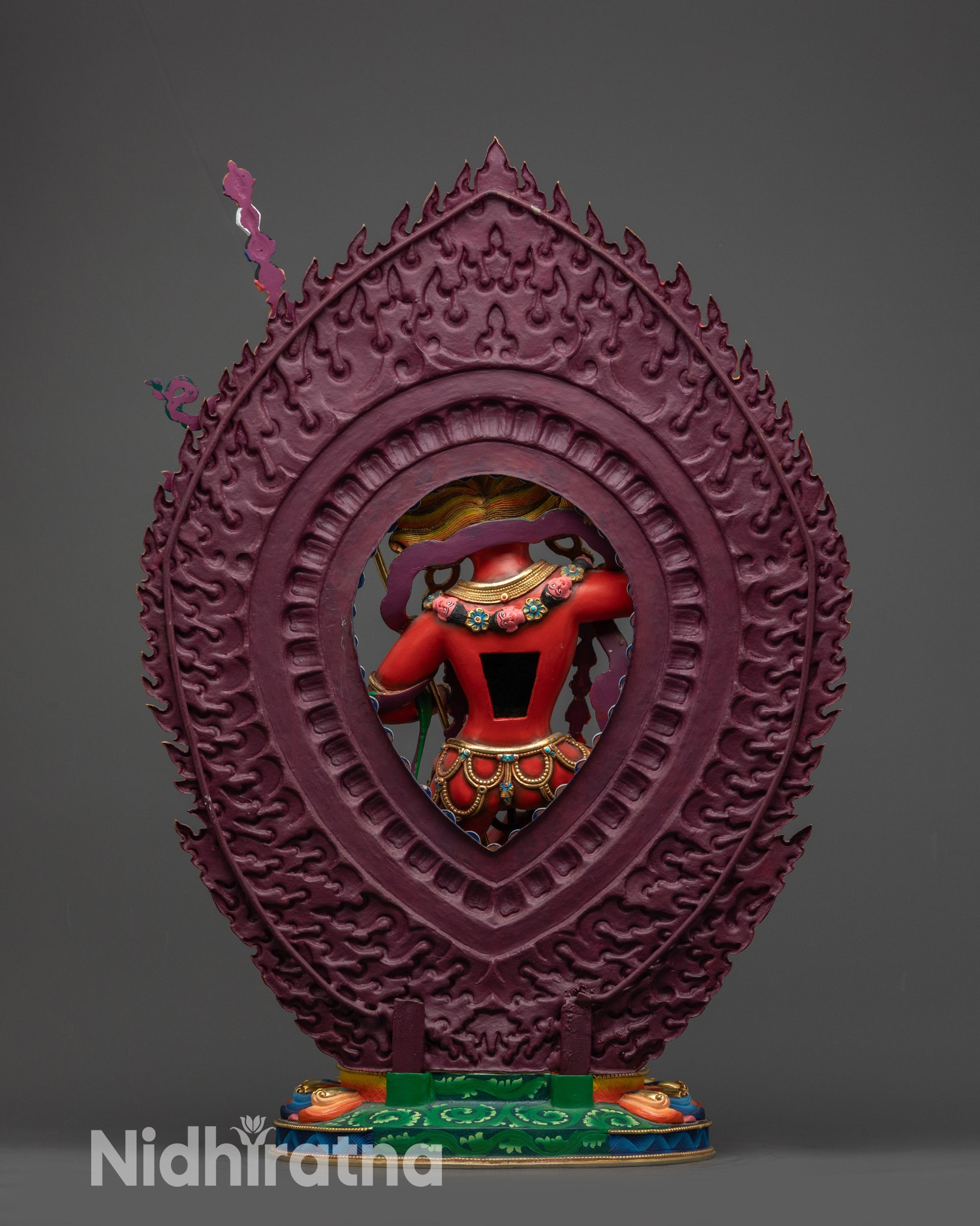 Back view of Dorje Phagmo statue showing halo, lotus base, and intricate jewelry