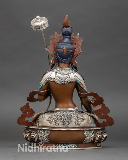 Back view of Dukar Sitatapatra statue, decorative lotus pedestal with floral and cloud motifs