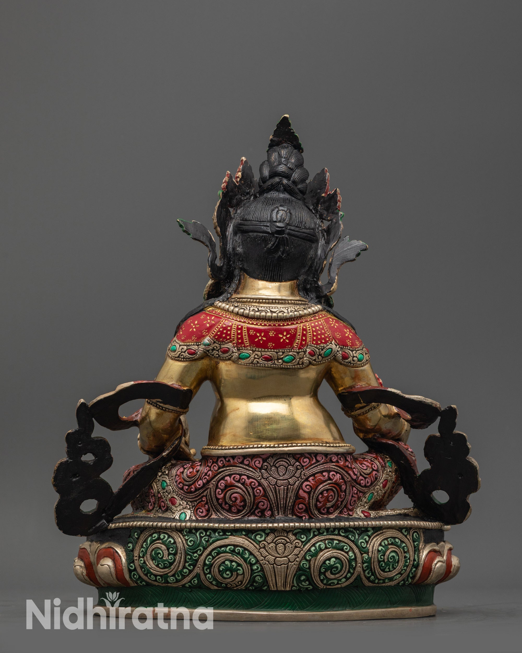 Back view of Dzambhala statue highlighting detailed carvings and hand-painted designs